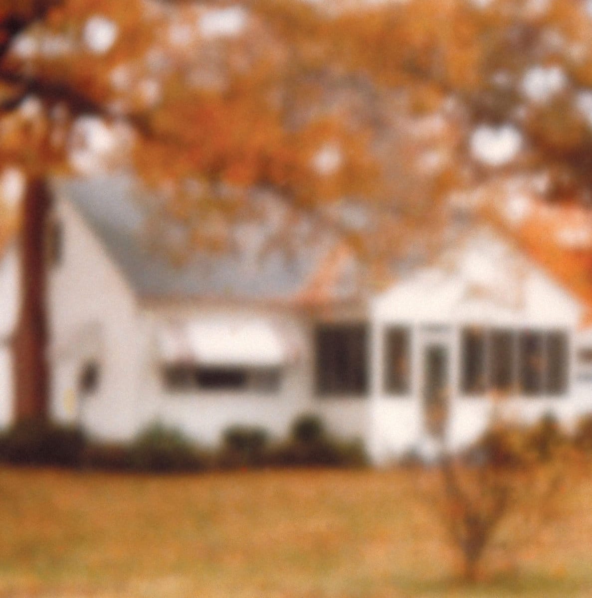 A blurry bungalow on the cover of the Rainbows from Atoms album