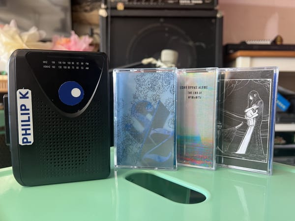 Philip K - branded portable cassette player and some tapes.