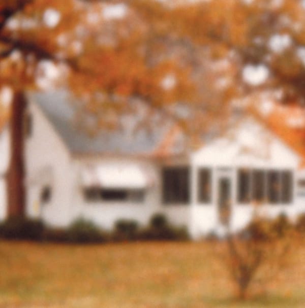 A blurry bungalow on the cover of the Rainbows from Atoms album